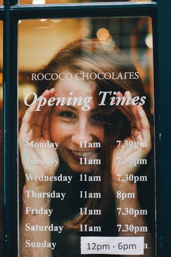 Woman Smiling Through the Glass Window