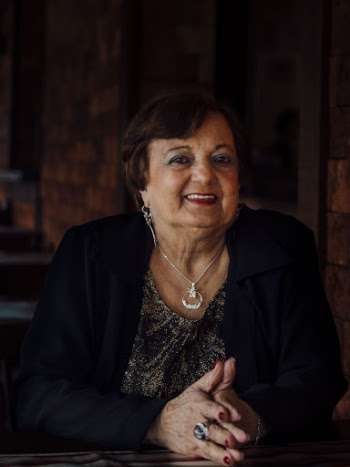 Woman Smiling Wearing Black Jacket