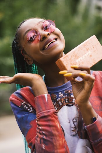 Woman Smiling While Holding Box