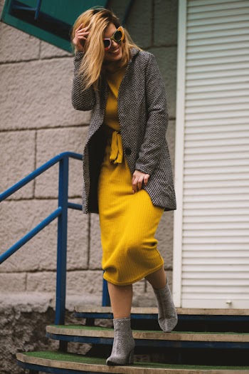 Woman Smiling While Walking on Stairs
