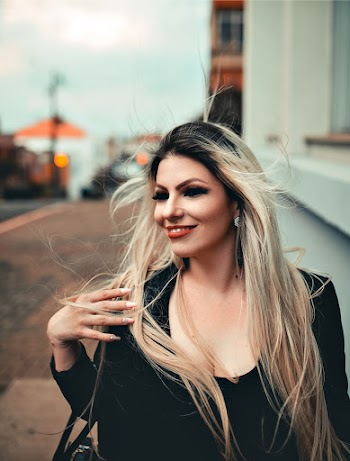 Woman Smiling While Wearing Black Top