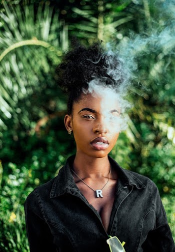 Woman Smoking While Wearing Black Top