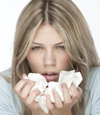 Woman sneeze with tissue on hand