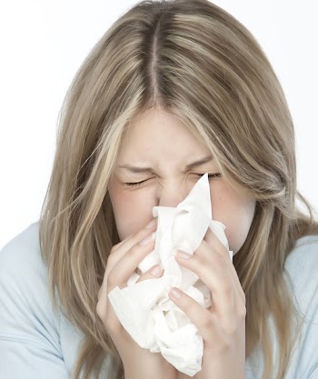 Woman sneezing