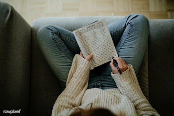 Woman solving word puzzles in Pennypress All Star Word Seeks during th.. | Free  photo - 2328042