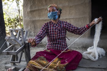 Woman spinning wool, Chitwan, Nepal, | Free Photo - rawpixel