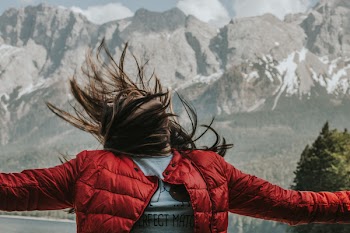 Woman Spreading Arms While Looking Above