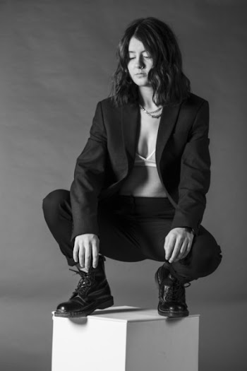 Woman Squatting On Platform