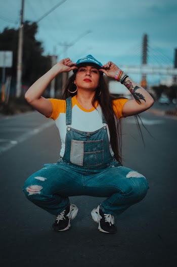 Woman Squatting on Road
