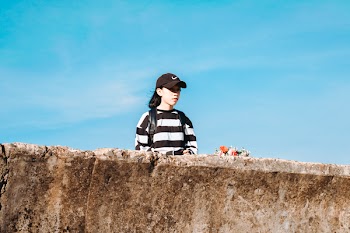 Woman Stand Beside Rock Formation