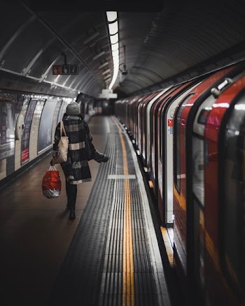 woman stand beside train