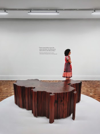 Woman Standing Against White Wall