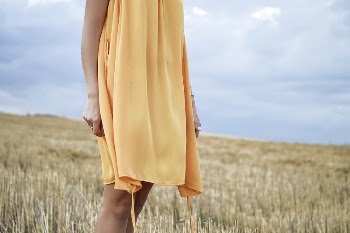 Woman standing amidst a field | Free Photo - rawpixel