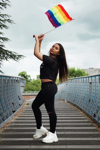 Woman Standing and Holding Flag
