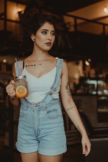 Woman Standing and Holding Mug