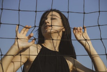 Woman Standing and Holding the Net