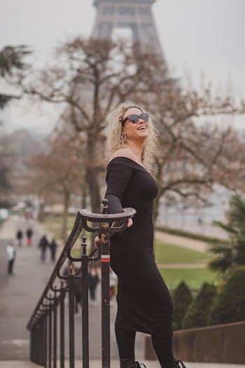 Woman Standing and Leaning Against Railing