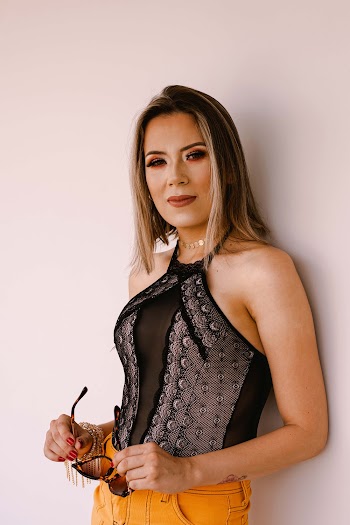 Woman Standing and Leaning on Wall