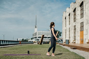 Woman Standing and Looking Building