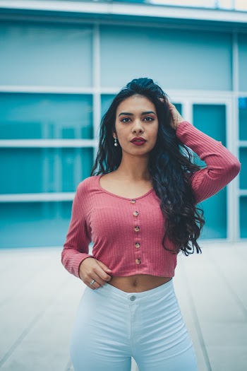 Woman Standing and Strikes a Pose