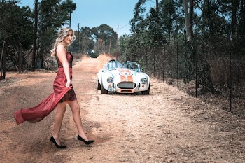 Woman Standing Away from White Car