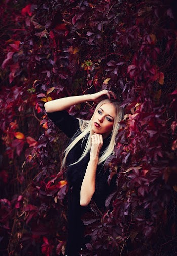 Woman Standing Behind Trees