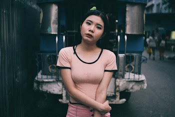 Woman Standing Behind Vehicle