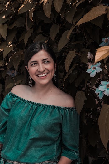 Woman Standing Beside a Green-leafed Tree