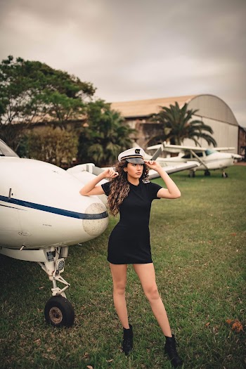 Woman Standing Beside Airplane
