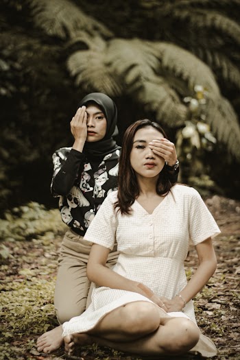 Woman Standing Beside Another Woman