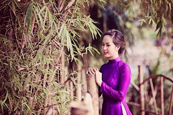 Woman Standing Beside Bamboo Plant