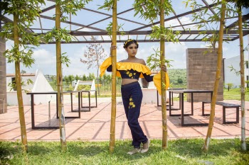 Woman Standing Beside Bamboos