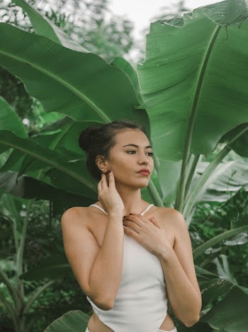 Woman Standing Beside Banana Tree