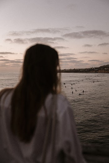 Woman Standing Beside Beach