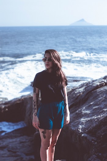 Woman Standing Beside Body of Water