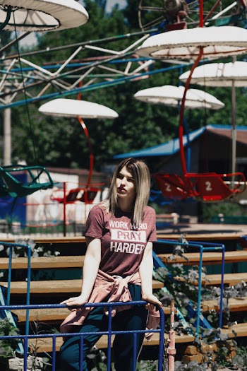 Woman Standing Beside Brown Bench