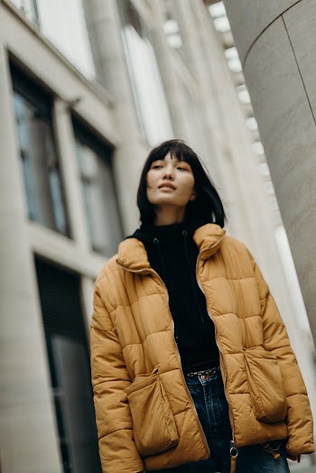 Woman Standing Beside Building