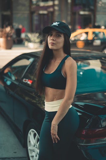 Woman Standing Beside Car