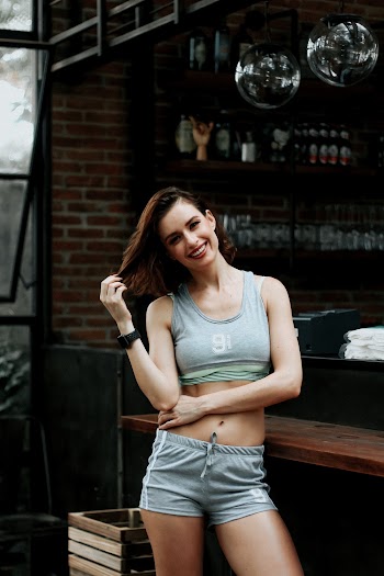 Woman Standing Beside Counter