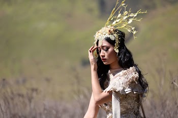 Woman Standing Beside Dried Leaves