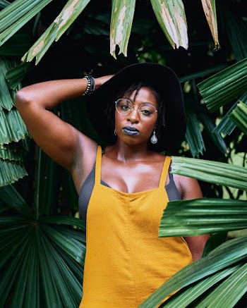 Woman Standing Beside Green Leafed Plant