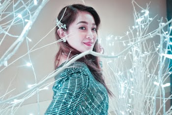 Woman Standing Beside Illuminated Plant