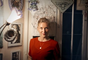 Woman Standing Beside Lantern