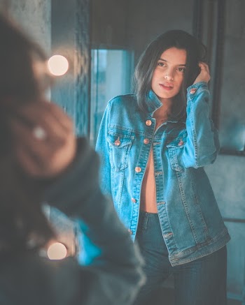 Woman Standing Beside Light Bulb