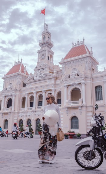 Woman Standing Beside Motorcycle
