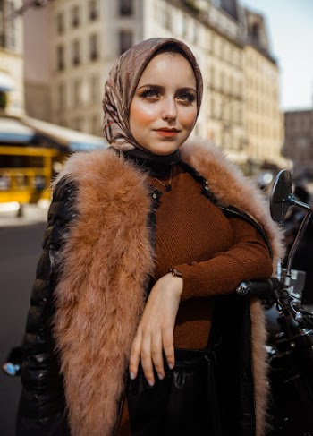 Woman Standing Beside Motorcycle