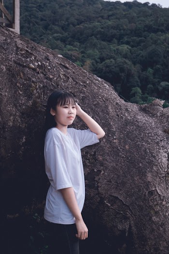 Woman Standing Beside of Tree