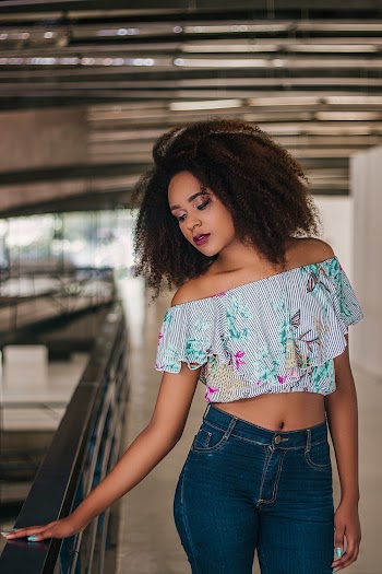 Woman Standing Beside Railing