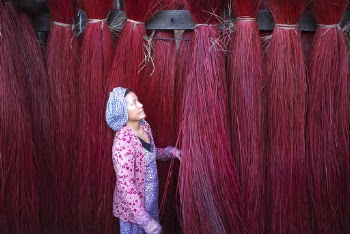 Woman Standing Beside Red Strings