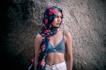 Woman Standing Beside Rock
